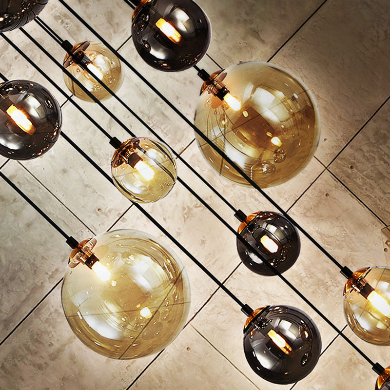 Suspension cascade 14 lampes DARK noir et laiton Schuller